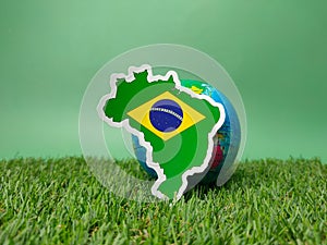 Brazil flag sticker is on a green field