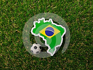 Brazil flag sticker is on a green field