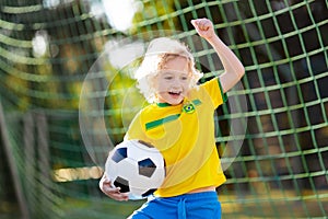 Brazil football fan kids. Children play soccer