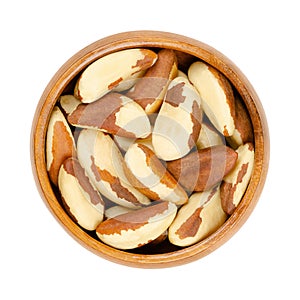 Brazil nuts, dried seeds of Bertholletia excelsa in wooden bowl
