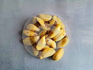 Brazil nuts, on a gray background, top view.