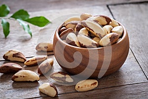 Brazil nuts in wooden bowl photo