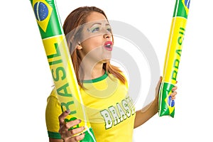 Brazilian woman fan celebrating on football match on white background. Brazil colors. Woman wearing generic brandless yellow photo