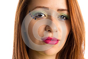 Brazilian woman fan celebrating on football match on white background. Brazil colors. photo