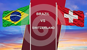 Brazil vs. Switzerland two flags on flagpoles and blue cloudy sky background