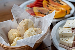 Brazilian breakfast concept with cheese, bread and fruit photo