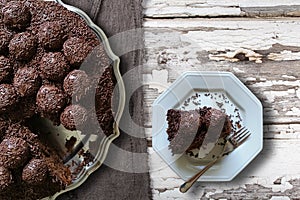 Brazilian Brigadier cake with cut piece on the plate