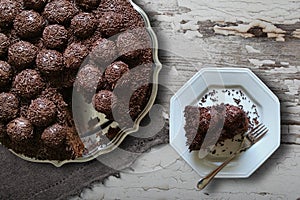 Brazilian Brigadier cake with cut piece on the plate