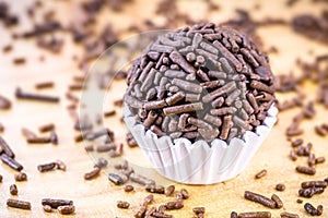 Brazilian candy made with chocolate and granulated amor edor. Called brigadeiro or negrinho, with punctual focus photo