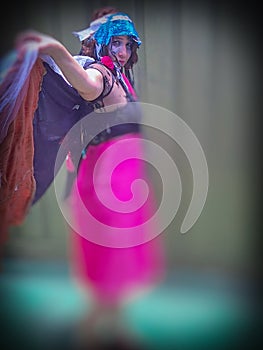 A Brazilian carnival costume with a dress, cape and headpieces photo