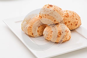 Brazilian cheese buns in white background. Pao de queijo