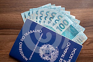 Brazilian document work and social security  Carteira de Trabalho e Previdencia Social with brazilian money