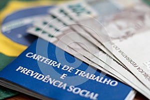 Brazilian document work and social security ( Carteira de Trabalho e Previdencia Social) with brazilian money