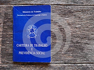 Brazilian document work and social security with wooden background