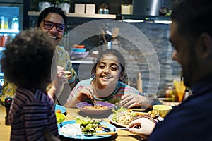 Brazilian family eating dinner together