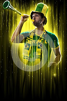 Brazilian fan, celebrating on a yellow and black backgroun