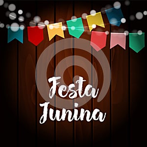 Brazilian Festa Junina greeting card, invitation. Party decoration, string of lights, paper flags. Old wooden background