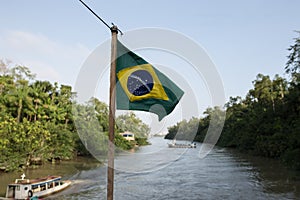 Brazilian flag in a boat in amazon photo