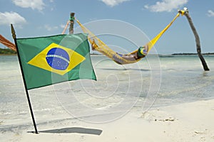Brazilian Flag Waving in front of Beach Hammocks