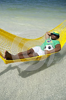 Brazilian Football Player Relaxing in Beach Hammock
