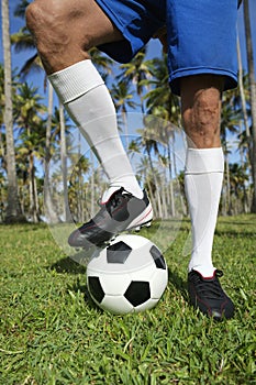 Brazilian Football Player Standing with Soccer Ball Palm Trees