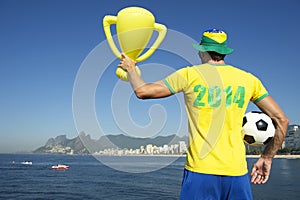 Brazilian Footballer in 2014 Shirt Celebrating with Trophy