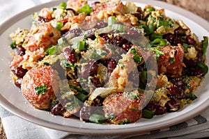 Brazilian fried Feijao Tropeiro with beans, sausage and bacon cl photo