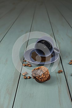 Brazilian fudge ball, traditional Brazilian sweet, next to cup and coffee beans_14