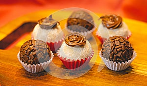 Brazilian gourmet brigadeiro with powdered milk and hazelnuts and traditional brigadeiro. Brazilian food, dessert. photo