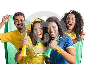 Brazilian group of fans celebrating on football match on white b