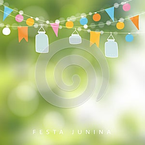 Brazilian june party, festa junina. String of lights, jar lanterns. Birthday party decoration. Blurred background.