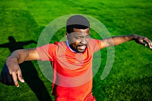 brazilian man goalkeeper catches the ball in the stadium during a football training