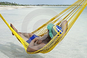 Brazilian Man Relaxing in Beach Hammock Brazil