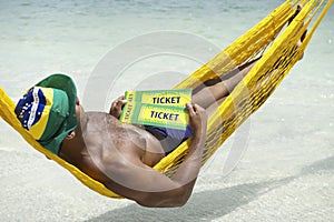 Brazilian Man Relaxing with Brazil Tickets