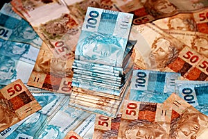 Brazilian money package with 50 and 100 reais notes photo
