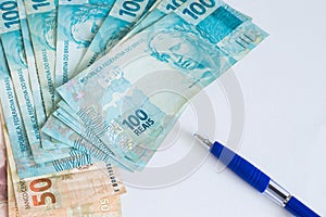 Brazilian money and pen / concept