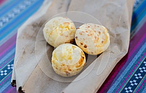 Brazilian and Paraguayan pan de queso or cheese bread at a street food market photo