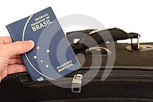 Brazilian passport being prepared for travel.