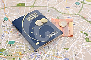 Brazilian passport, euros and map for travel abroad.