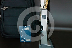 Brazilian passport near a backpack.Travel concept