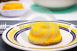 Brazilian quindim is a sweet made from egg yolk, sugar and grated coconut. Corresponds to the Portuguese recipe known as brisa-do- photo