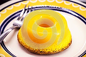 Brazilian quindim is a sweet made from egg yolk, sugar and grated coconut. Corresponds to the Portuguese recipe known as brisa-do- photo