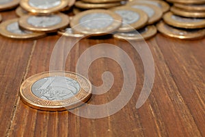 Brazilian Real coin on a wood table