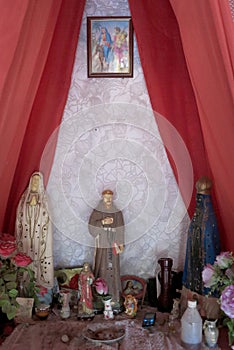 Brazilian religious altar mixing elements of umbanda, candomble and catholicism in the syncretism present in the local culture