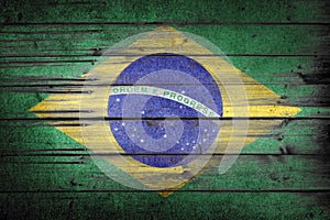 Brazilian rustic, vintage and weathered flag painted on wooden wall. photo