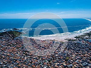 Brazilian small beautiful City Arraial do Cabo . Aerial drone photo from above city line. Red Roofs, narrow streets photo