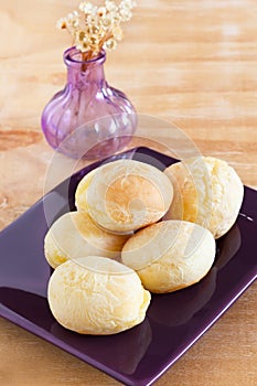 Brazilian snack cheese bread (pao de queijo) on plate vase