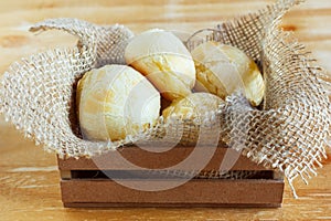 Brazilian snack cheese bread (pao de queijo) in wicker basket