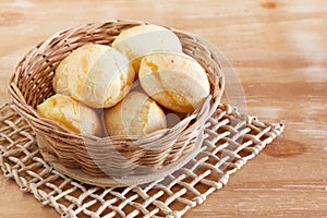 Brazilian snack cheese bread (pao de queijo) in wicker basket