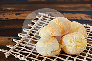 Brazilian snack cheese bread (pao de queijo) on wooden table